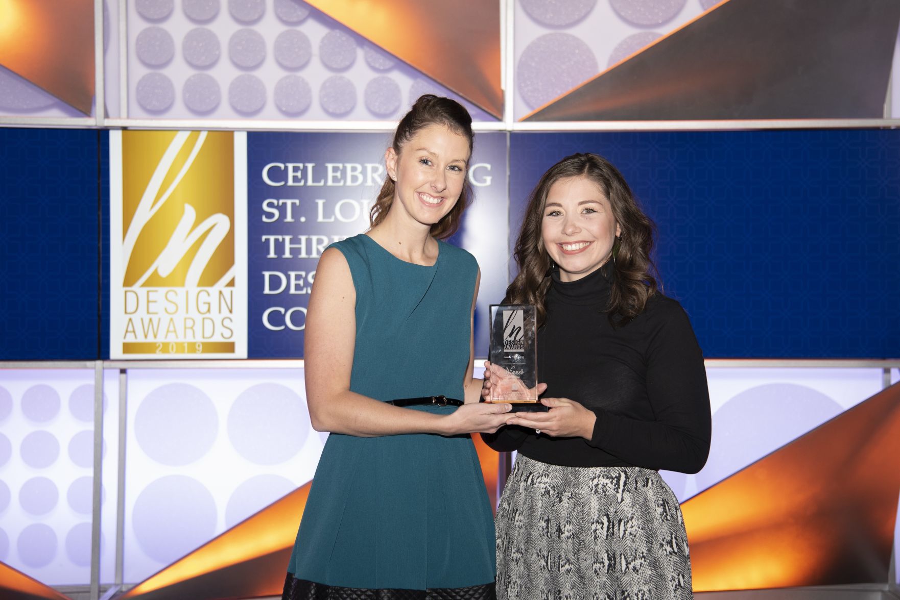 Alecia Humphreys with Jamie Reeves accepting on behalf of Amy Studebaker, 2019 Ladue News Design Award Winner